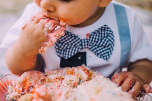 baby eating cake