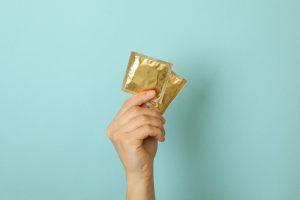 So You Had Unprotected Sex. When Can You Take A Pregnancy Test? 3 female holding condoms